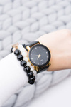 Elegant Ladies Black and Gold Watch on Belt
