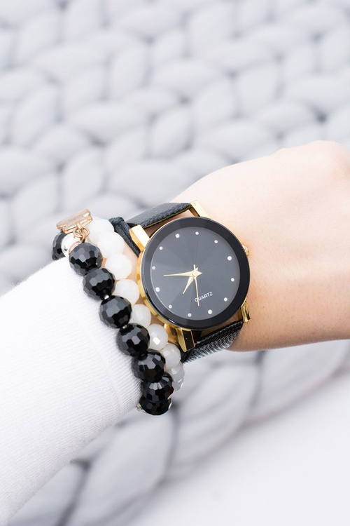 Elegant Ladies Black and Gold Watch on Belt