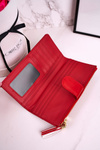 Veľká dámska peňaženka s ďalšou kabelkou a červenými strapcami